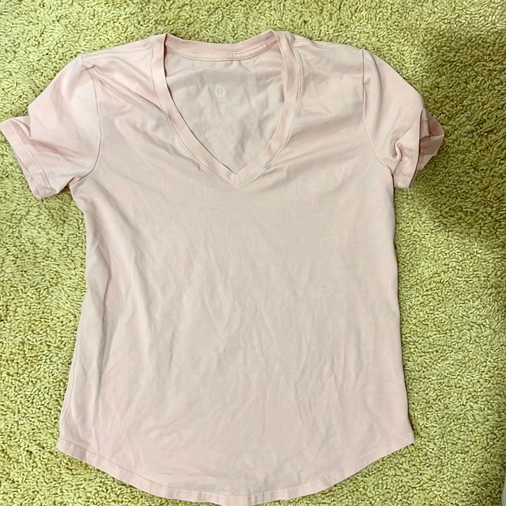 I am selling a Lululemon light pink T-shirt only worn once